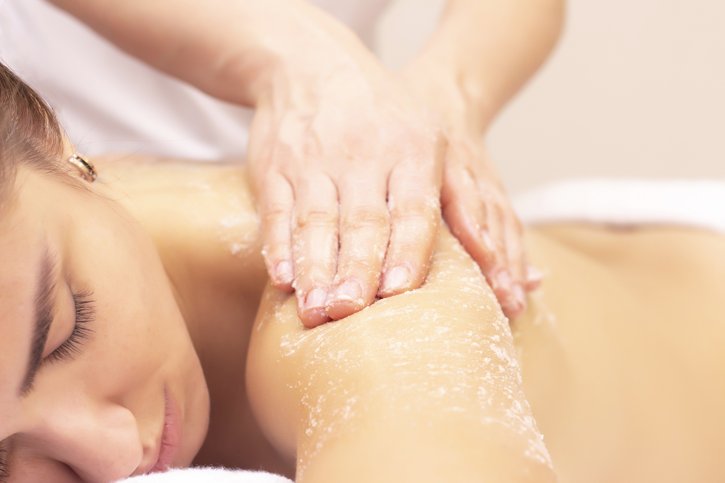 massage-and-skin-cleansing-with-scrub-beautiful-girl-gets-scrub-in-spa-salon