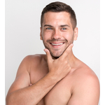 handsome-young-smiling-man-looking-at-camera-and-keeping-hand-on-chin-while-standing-against-white-wall