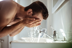 handsome-young-naked-man-is-washing-his-face-bathroom-home